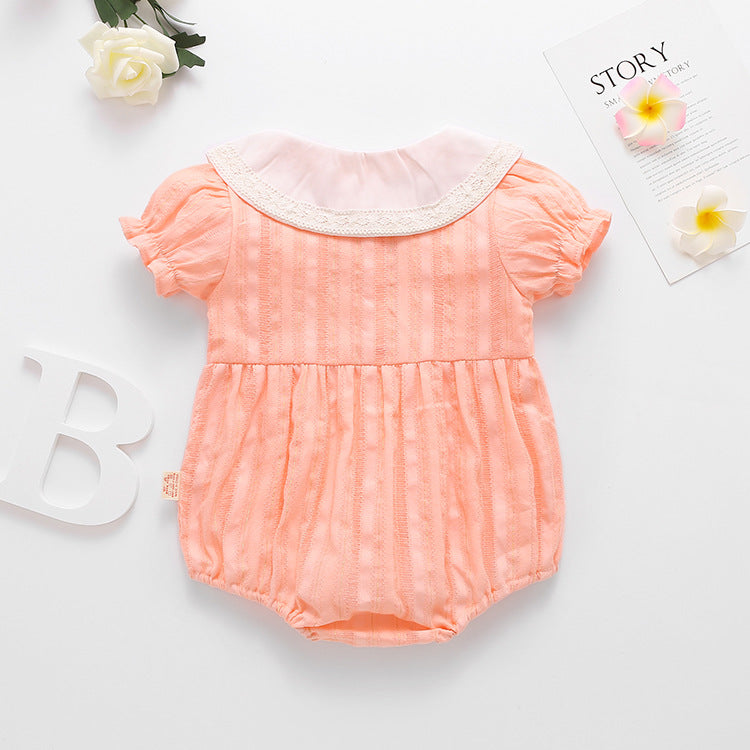 Baby girl onesie featuring floral embroidery design in pink, yellow, and beige colors, perfect for summer wear.