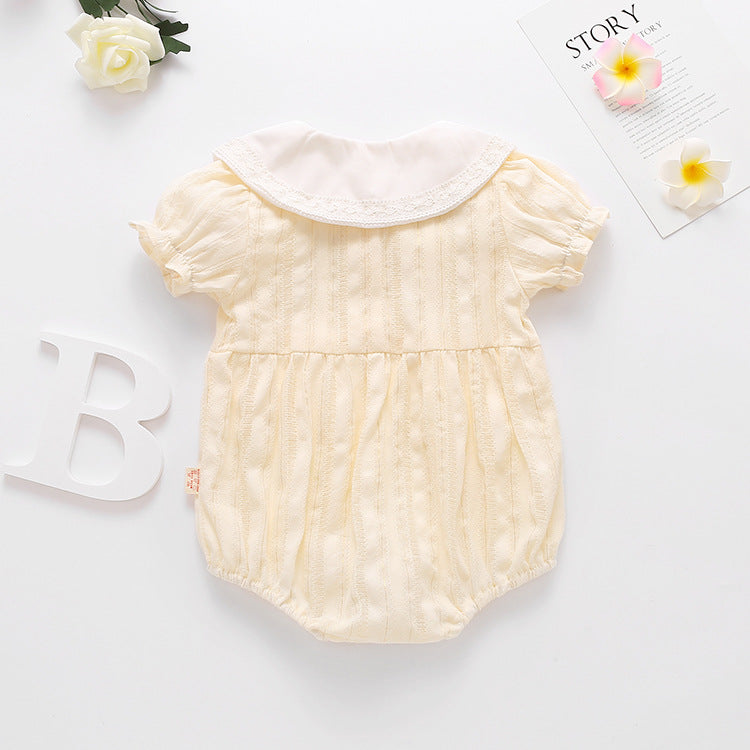 Baby girl onesie featuring floral embroidery design in pink, yellow, and beige colors, perfect for summer wear.