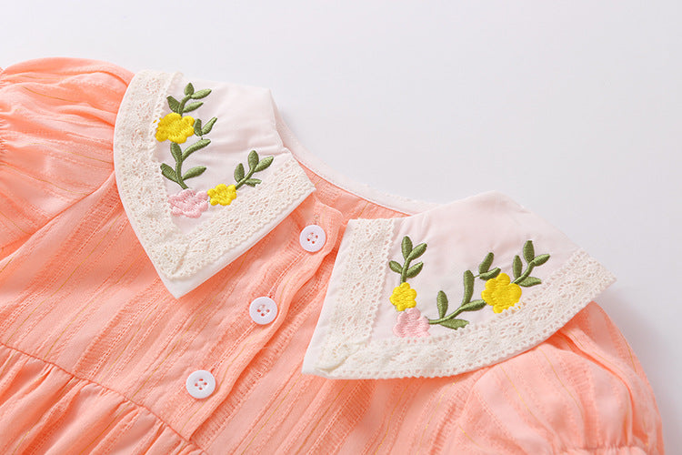 Baby girl onesie featuring floral embroidery design in pink, yellow, and beige colors, perfect for summer wear.