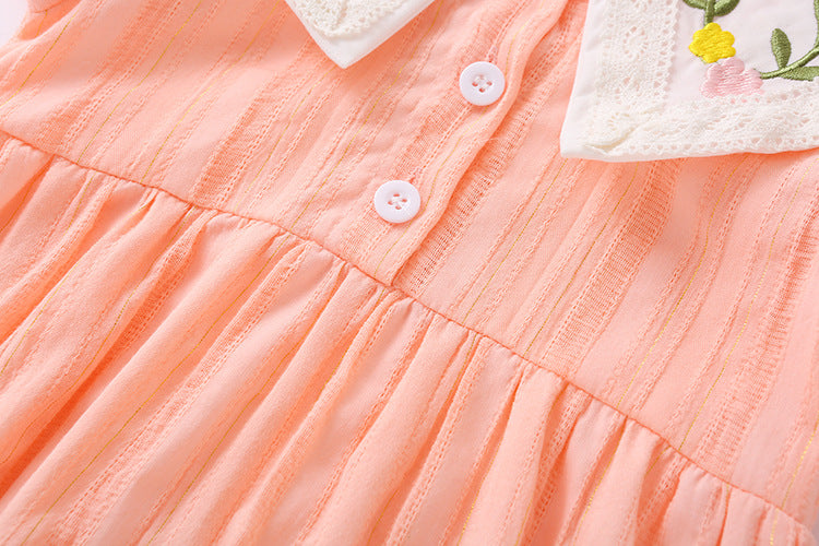 Baby girl onesie featuring floral embroidery design in pink, yellow, and beige colors, perfect for summer wear.