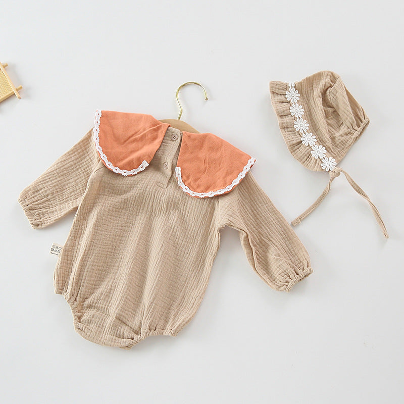 Baby girl wearing a floral embroidered bodysuit with long sleeves and a matching hat, perfect for autumn.