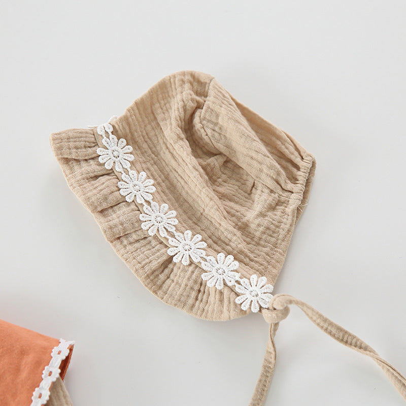 Baby girl wearing a floral embroidered bodysuit with long sleeves and a matching hat, perfect for autumn.