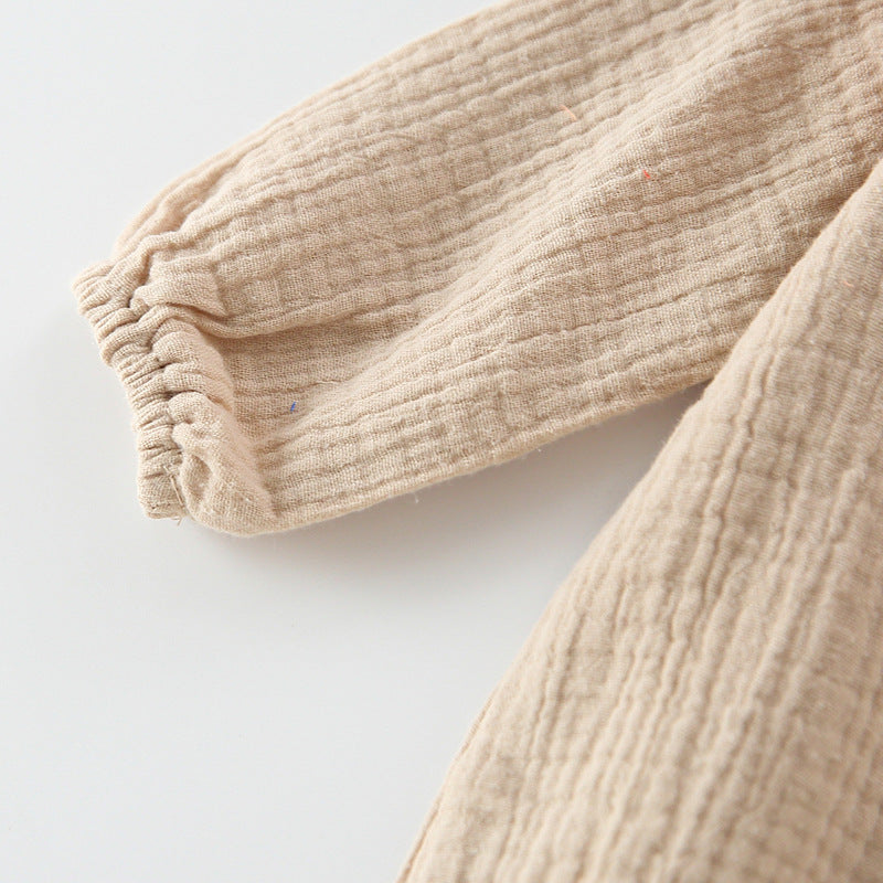 Baby girl wearing a floral embroidered bodysuit with long sleeves and a matching hat, perfect for autumn.