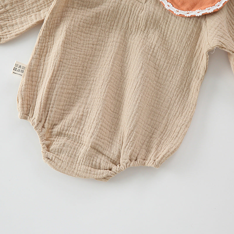 Baby girl wearing a floral embroidered bodysuit with long sleeves and a matching hat, perfect for autumn.