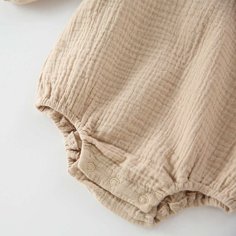 Baby girl wearing a floral embroidered bodysuit with long sleeves and a matching hat, perfect for autumn.