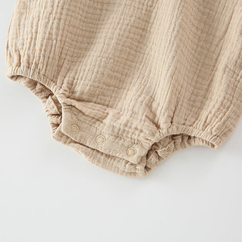 Baby girl wearing a floral embroidered bodysuit with long sleeves and a matching hat, perfect for autumn.