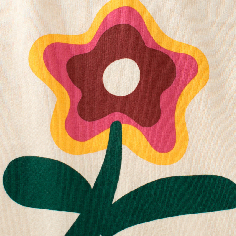 A vibrant yellow long sleeve top for baby girls featuring a colorful floral graphic design, made from soft cotton material.