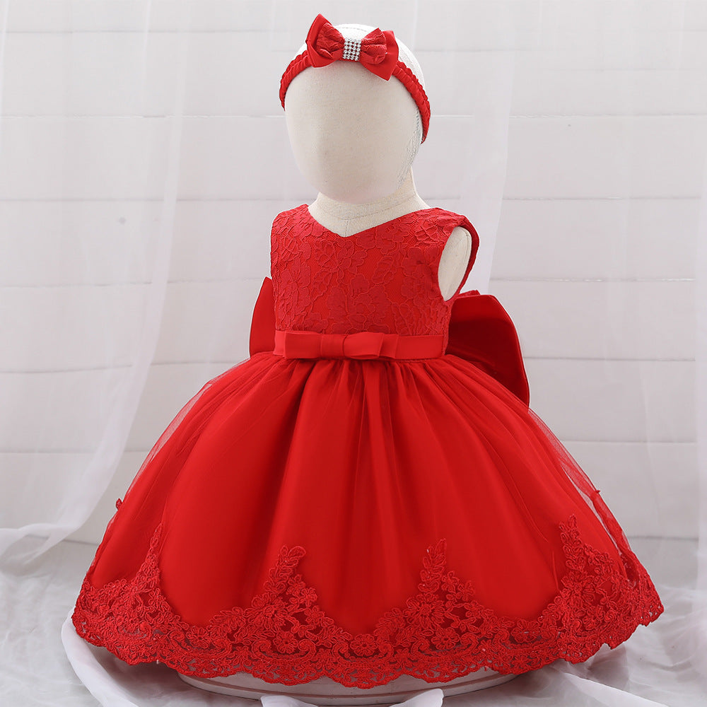 Baby girl wearing a floral mesh overlay formal dress with matching headband, perfect for special occasions.
