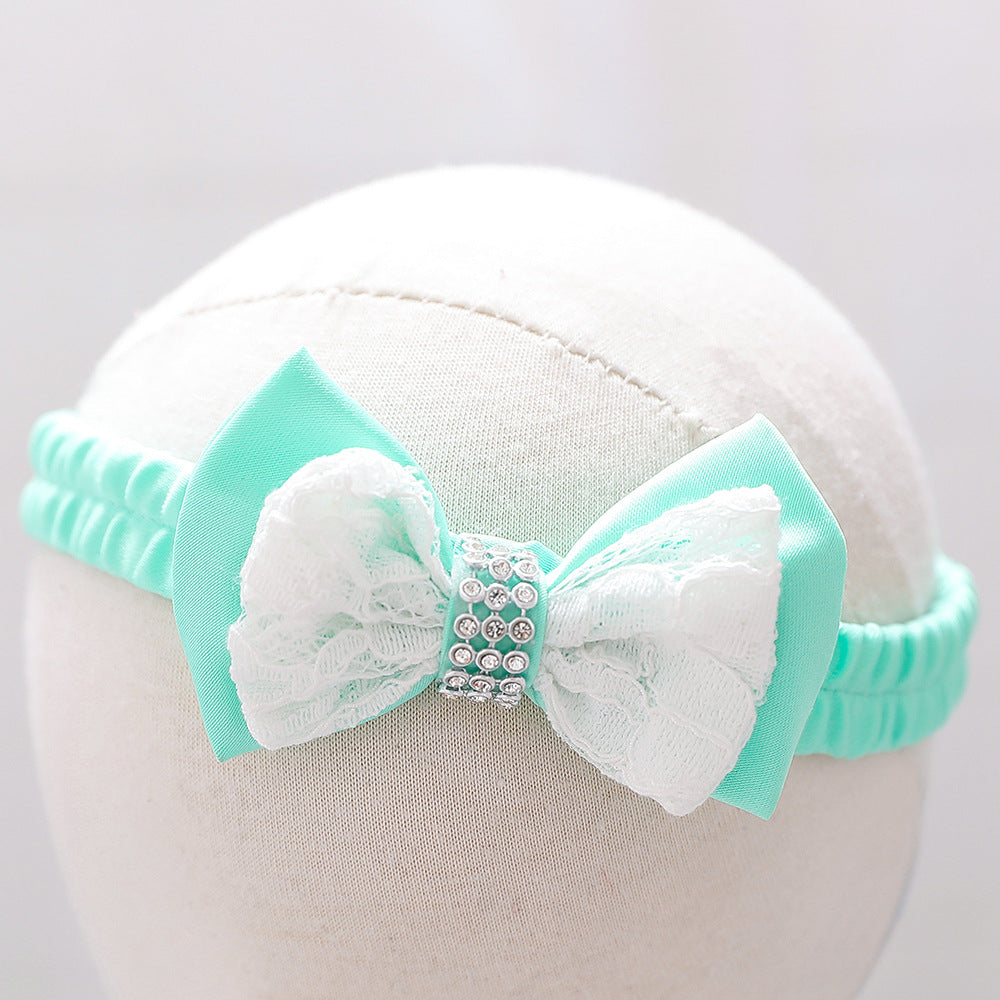 Baby girl wearing a floral mesh overlay formal dress with matching headband, perfect for special occasions.