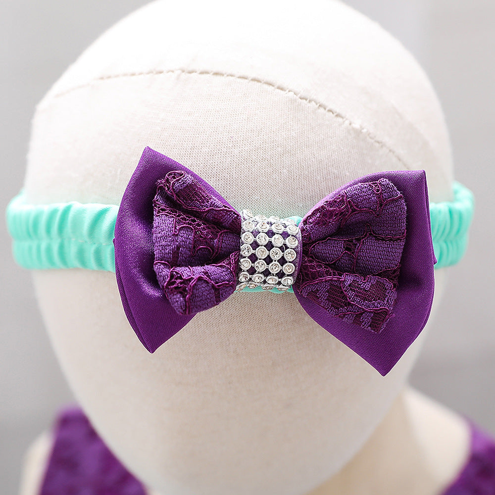 Baby girl wearing a floral mesh overlay formal dress with matching headband, perfect for special occasions.