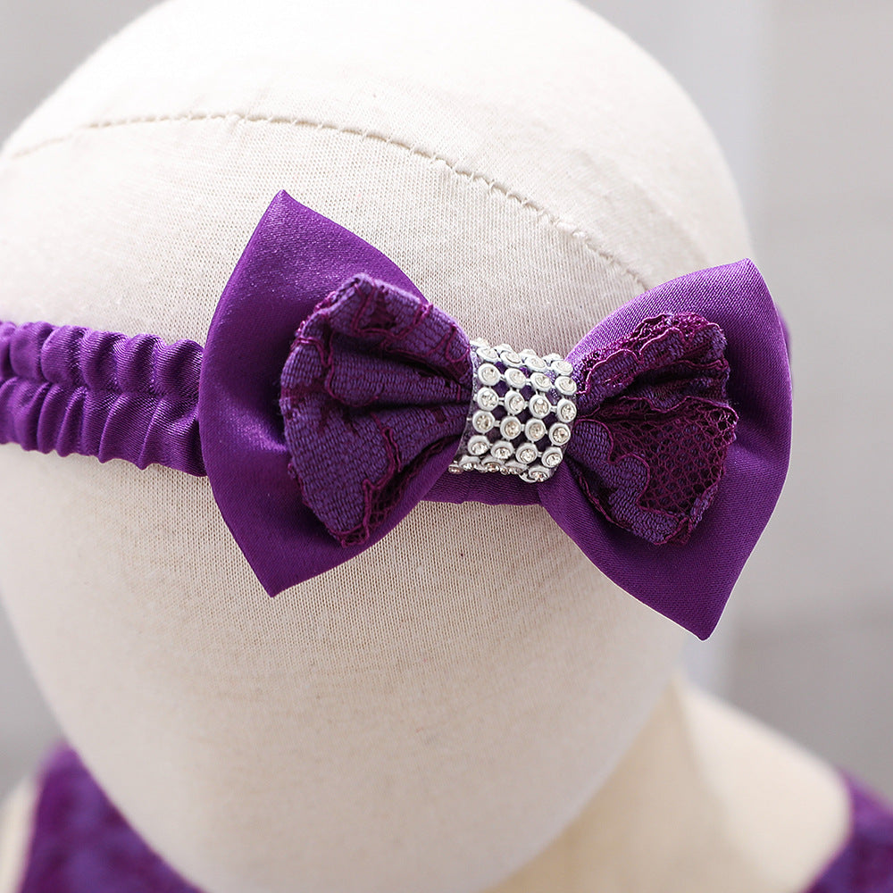 Baby girl wearing a floral mesh overlay formal dress with matching headband, perfect for special occasions.