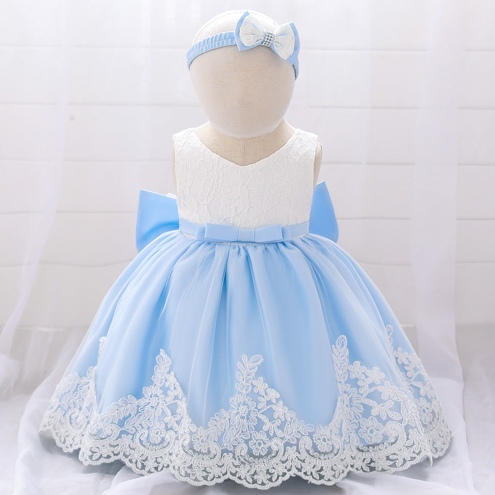 Baby girl wearing a floral mesh overlay formal dress with matching headband, perfect for special occasions.