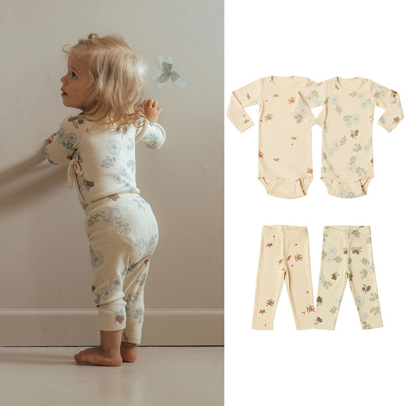 Baby girl floral pattern cotton onesie set featuring a soft onesie and matching pants in green and apricot colors.