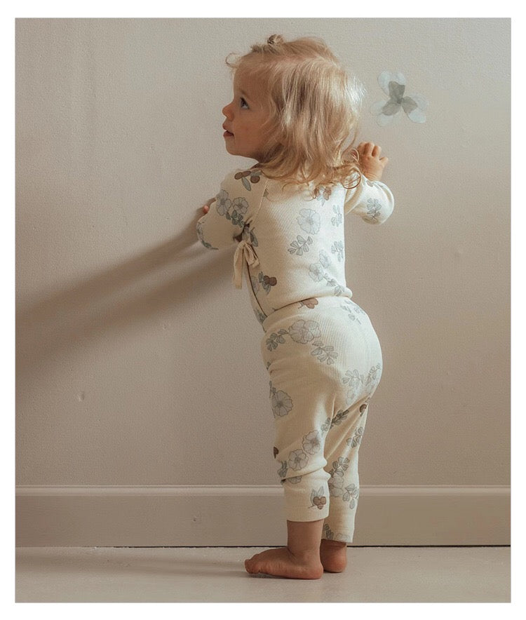 Baby girl floral pattern cotton onesie set featuring a soft onesie and matching pants in green and apricot colors.