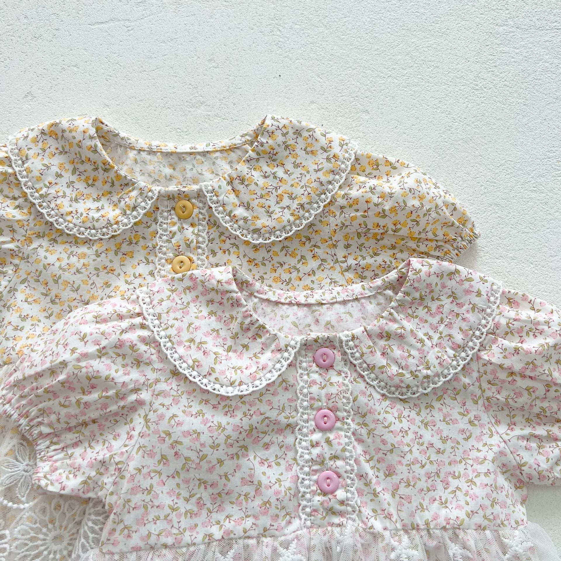 Baby girl floral pattern onesies dress with mesh patches in pink and yellow, perfect for summer wear.