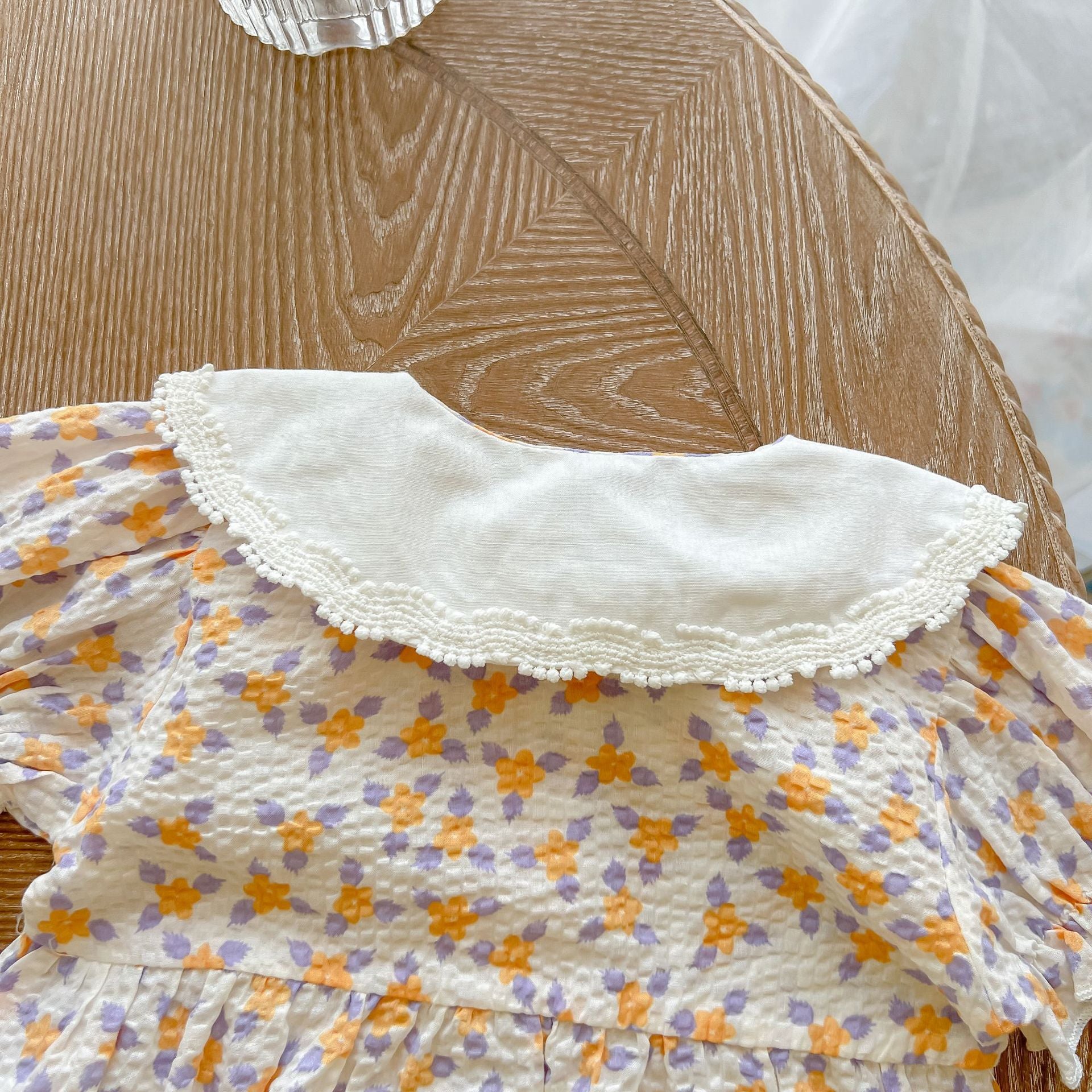 Baby girl floral print onesie with embroidered collar, perfect for summer wear.