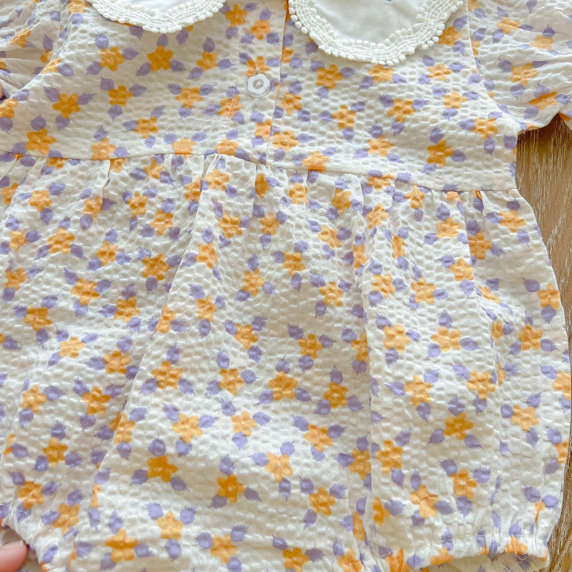 Baby girl floral print onesie with embroidered collar, perfect for summer wear.