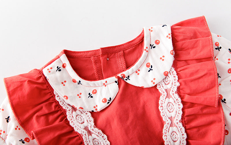 Baby girl onesie featuring floral print, lace patchwork, and ruffle design in vibrant red color.
