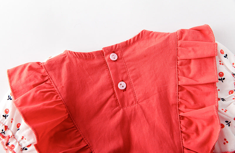 Baby girl onesie featuring floral print, lace patchwork, and ruffle design in vibrant red color.