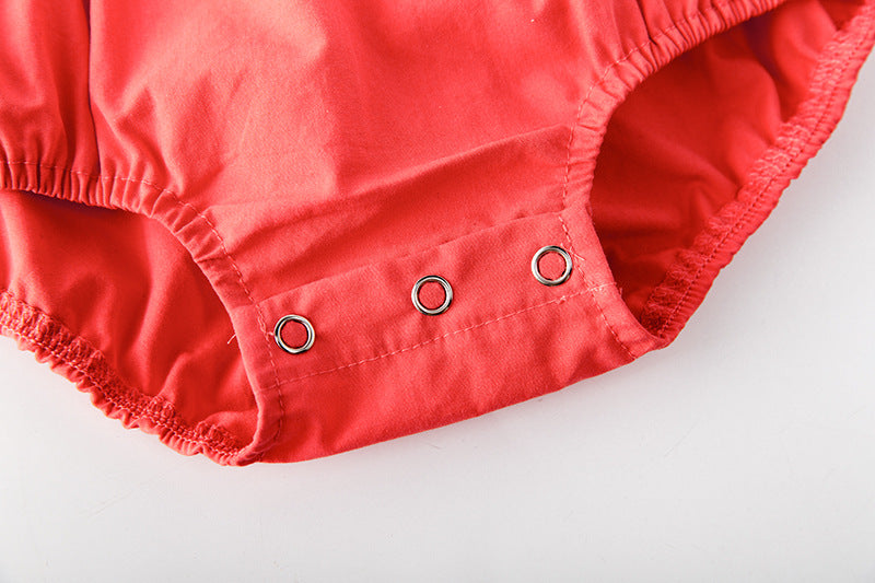 Baby girl onesie featuring floral print, lace patchwork, and ruffle design in vibrant red color.