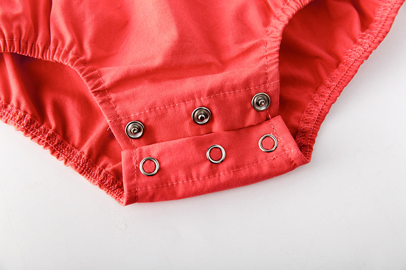 Baby girl onesie featuring floral print, lace patchwork, and ruffle design in vibrant red color.