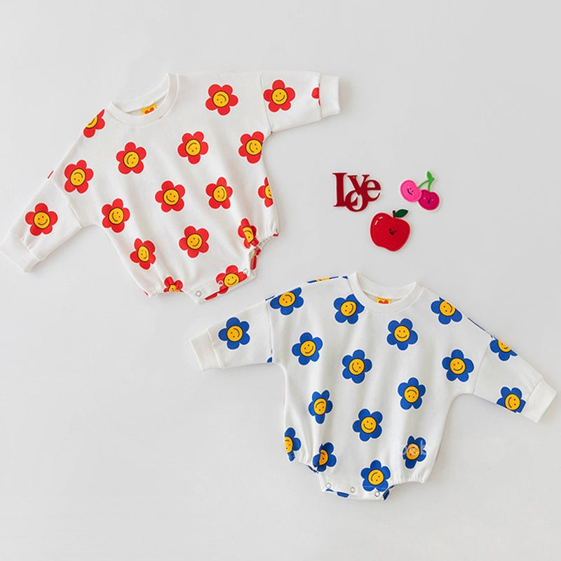 Baby girl wearing a flower graphic long sleeves cotton triangle bodysuit in red, showcasing a vibrant floral design.