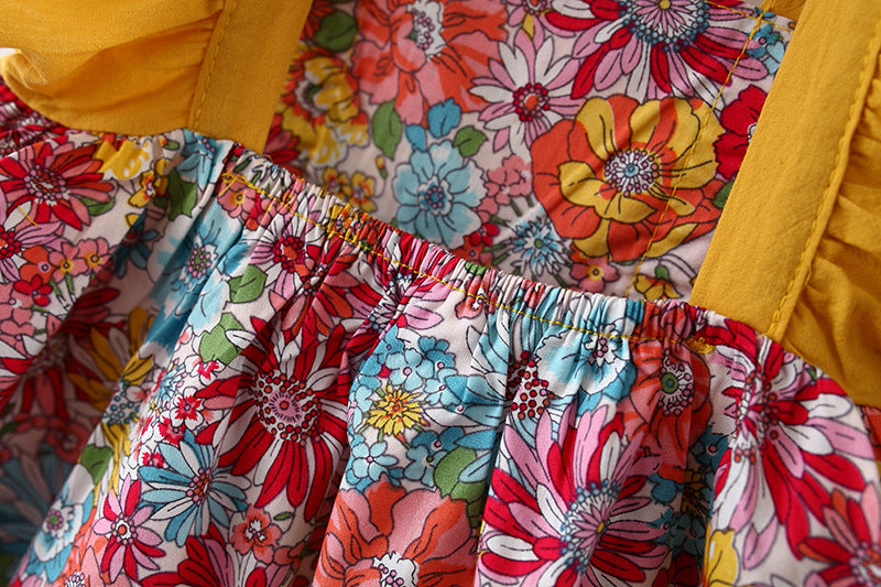 Adorable baby girl dress featuring a floral pattern and butterfly sleeves, accompanied by a matching hat, perfect for summer occasions.