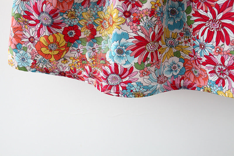 Adorable baby girl dress featuring a floral pattern and butterfly sleeves, accompanied by a matching hat, perfect for summer occasions.