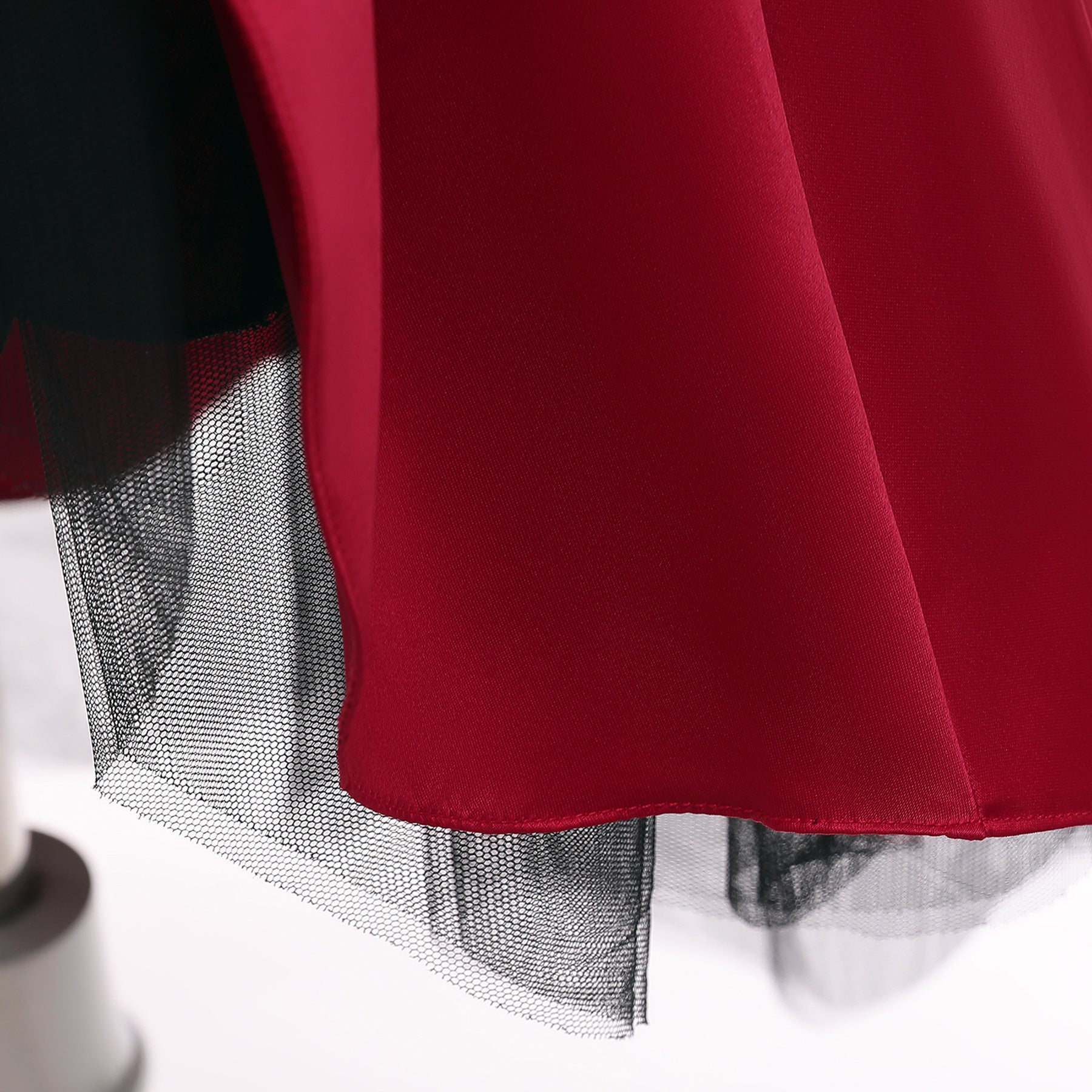 A beautiful baby girl wearing a floral pattern show dress in vibrant colors, perfect for birthday parties and formal occasions.