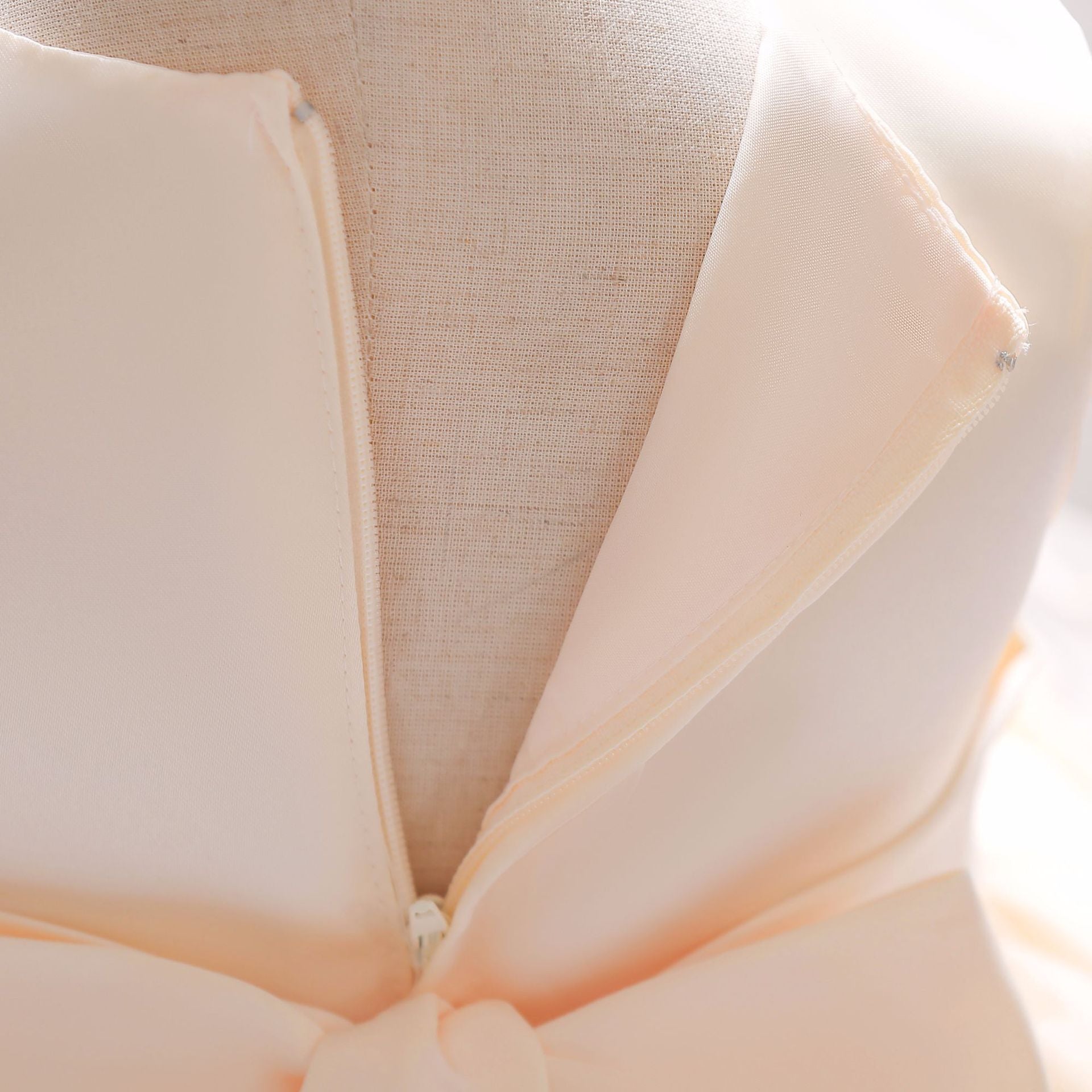 Baby girl wearing a Full Moon Christening Trailing Tutu Formal Dress in white, showcasing delicate tulle fabric and a graceful trailing skirt.