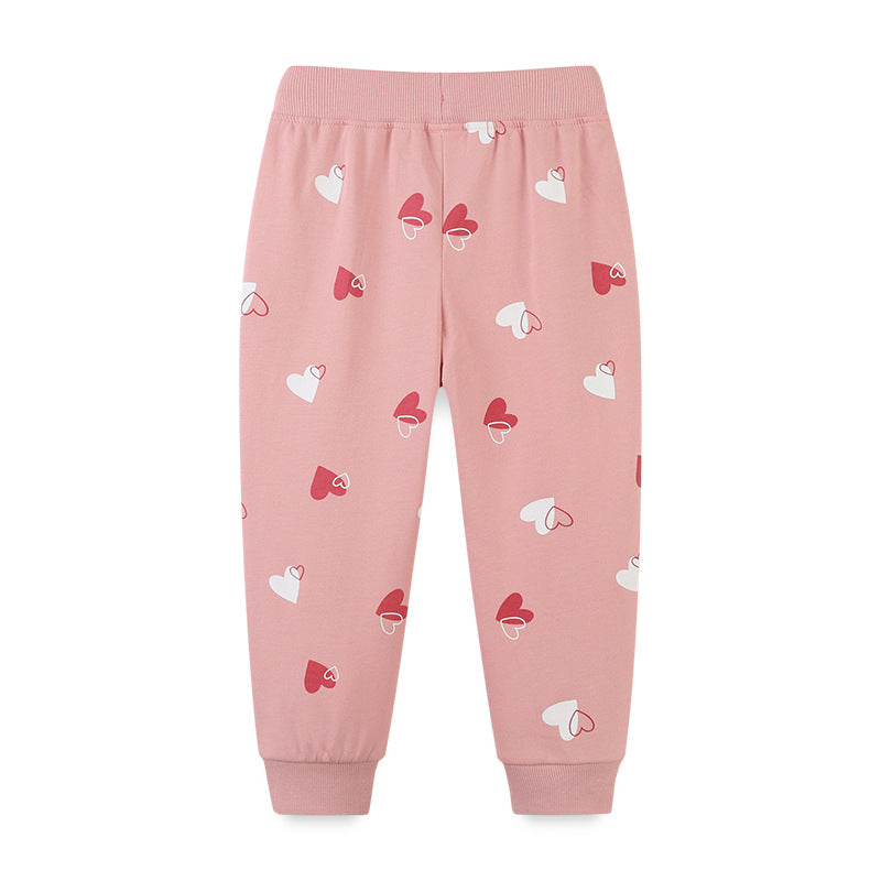 Baby girl sport trousers featuring a heart print pattern in pink color, made from soft cotton material, perfect for casual wear.