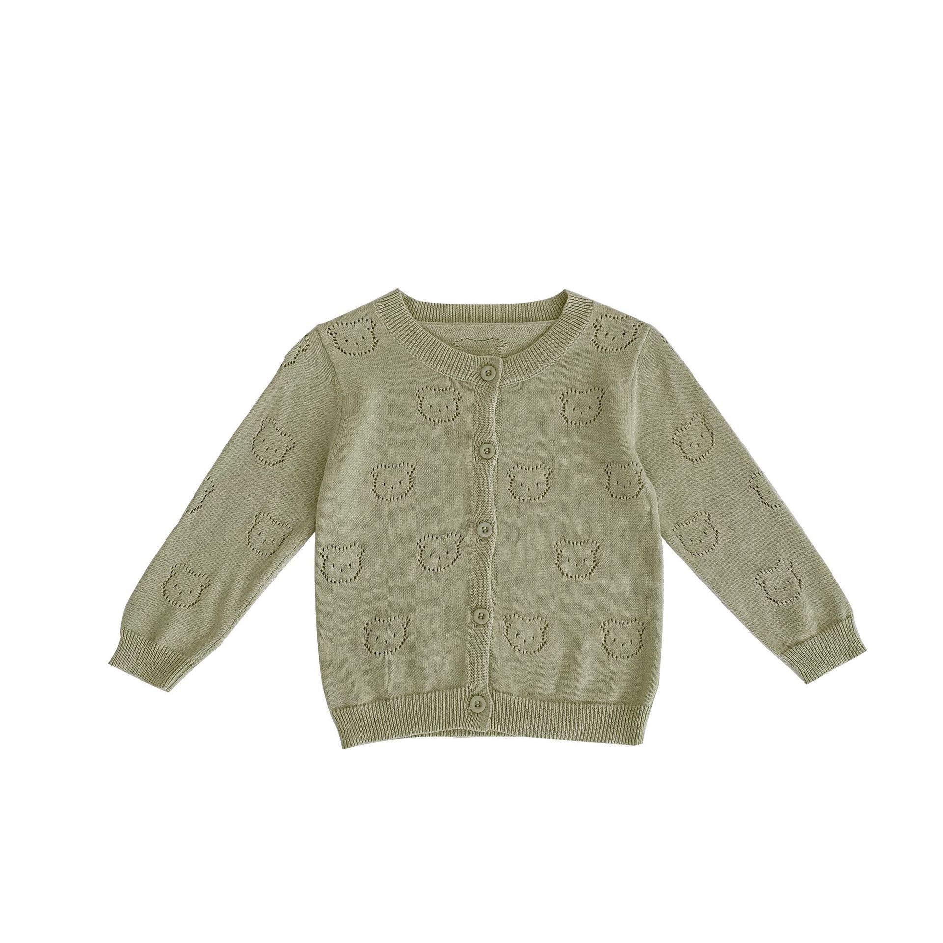 A soft cotton cardigan for baby girls featuring a hollow carved design, available in white, pink, and green.