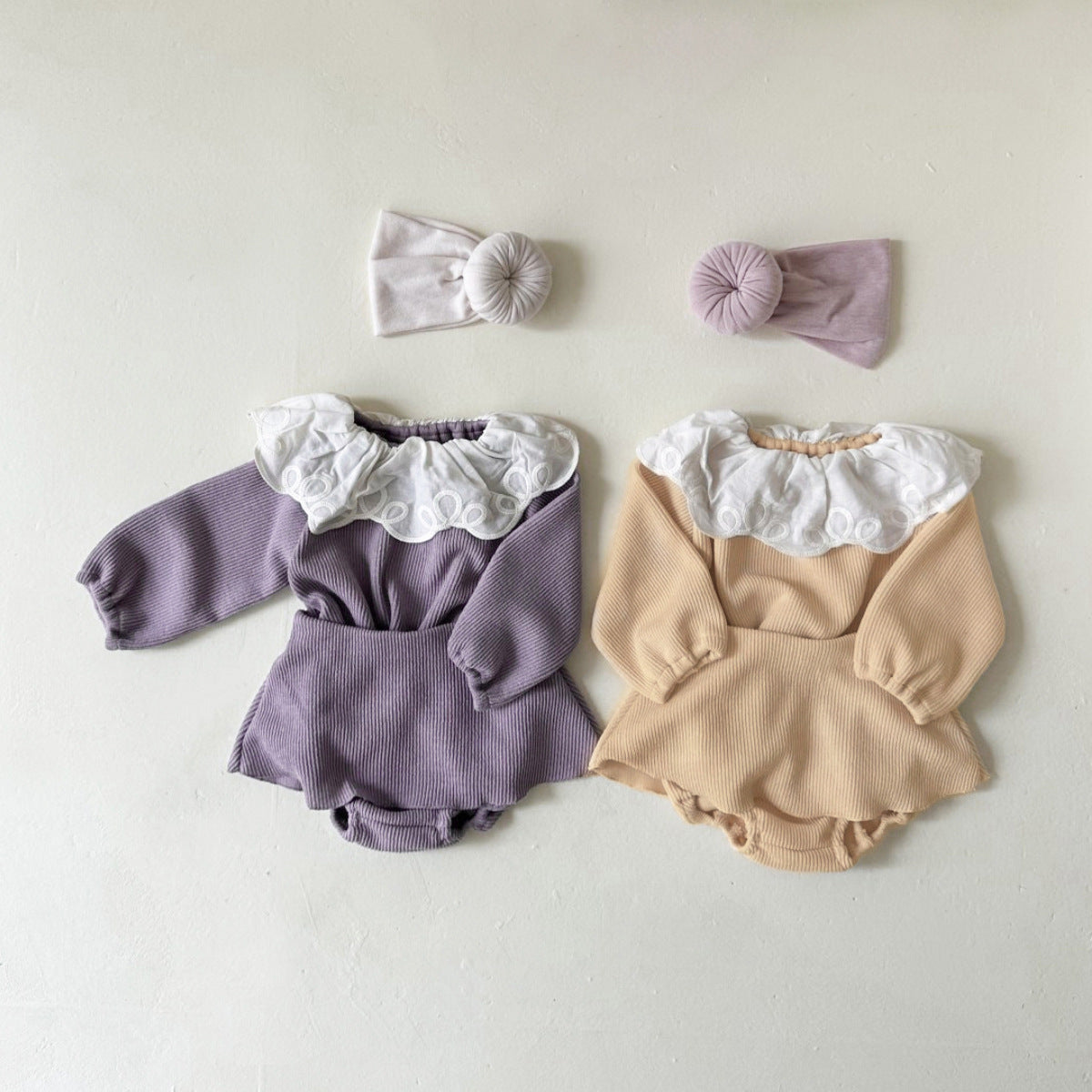 Baby girl two-piece set featuring laces round collars in purple and apricot colors, made from soft cotton material.