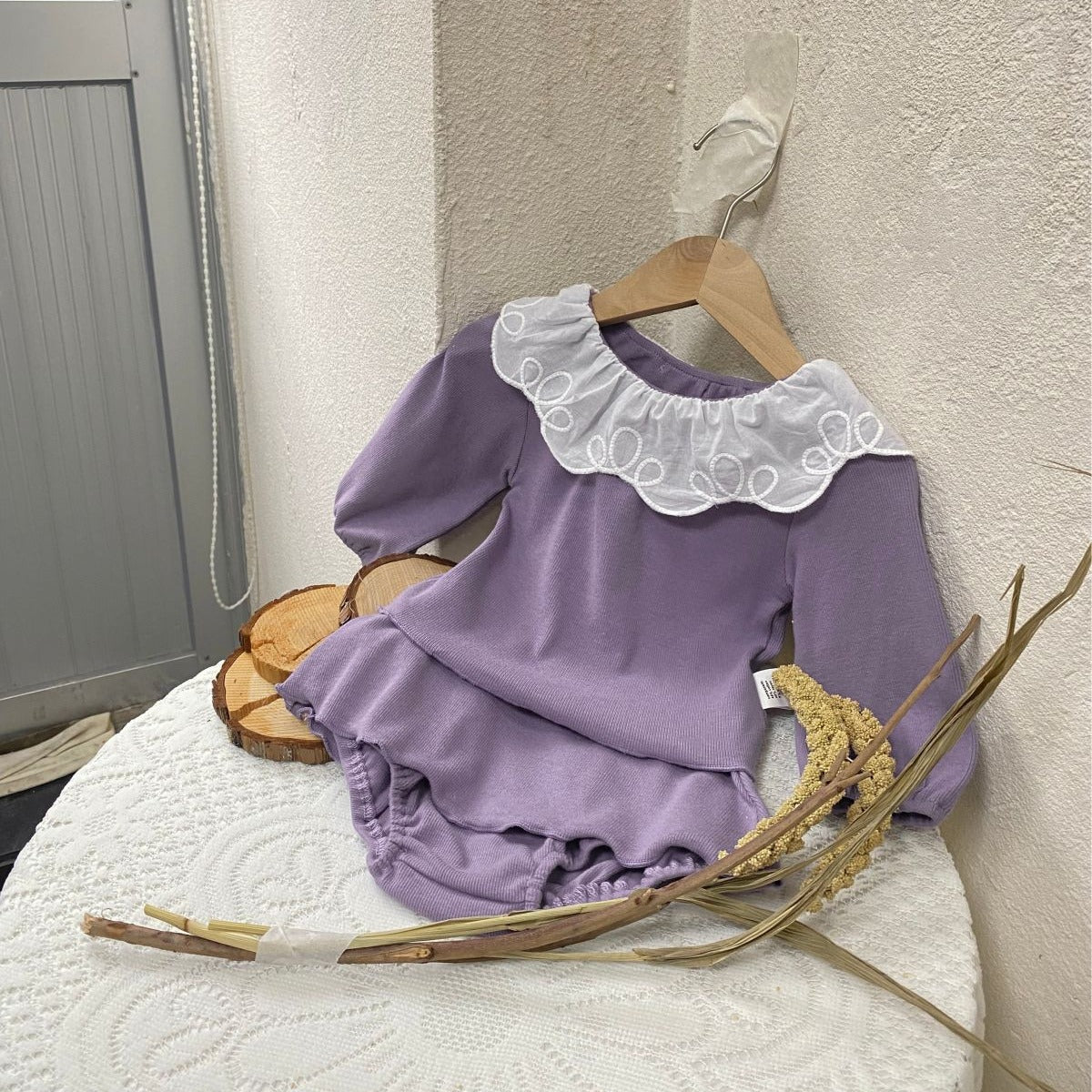 Baby girl two-piece set featuring laces round collars in purple and apricot colors, made from soft cotton material.