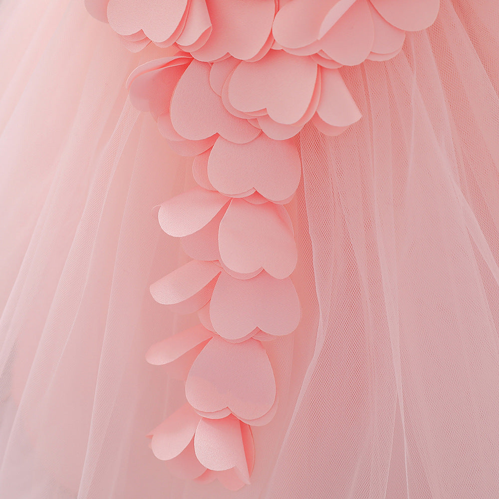 Baby girl wearing a petal patched design sleeveless full moon christening mesh dress in a beautiful floral pattern.