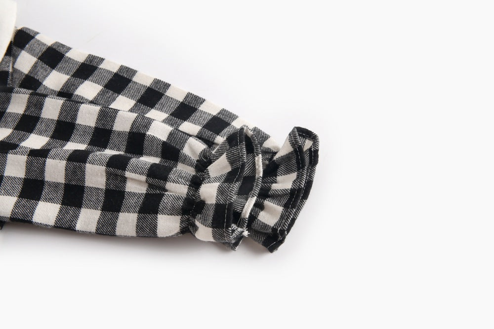 Baby girl long sleeve onesie featuring a plaid pattern and doll collar design in black and grey colors.