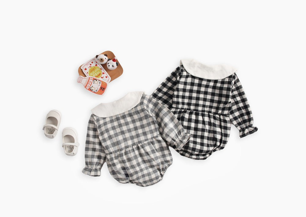 Baby girl long sleeve onesie featuring a plaid pattern and doll collar design in black and grey colors.