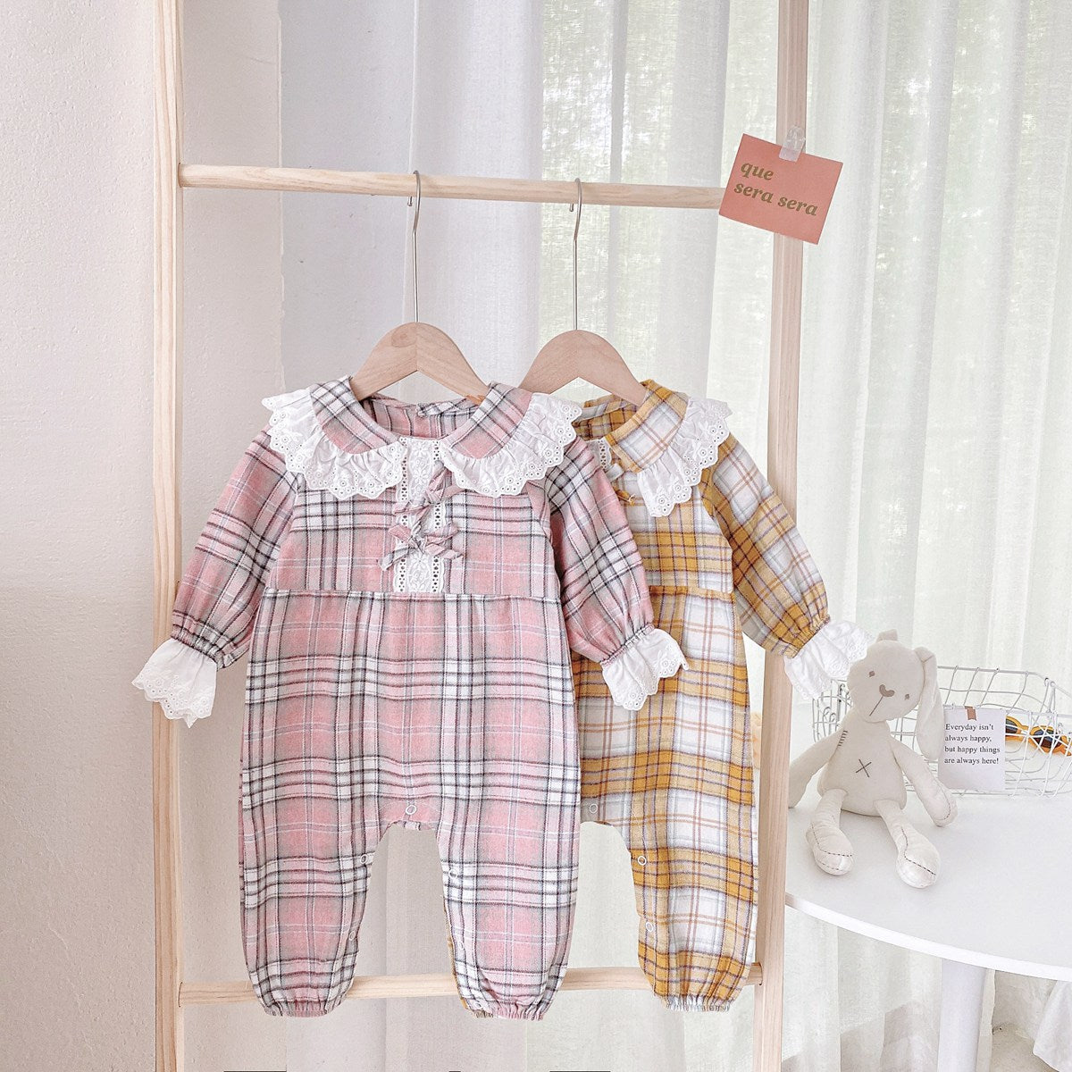 Baby girl romper featuring a plaid pattern and mesh patchwork design with a doll neck bow tie, available in pink and yellow.