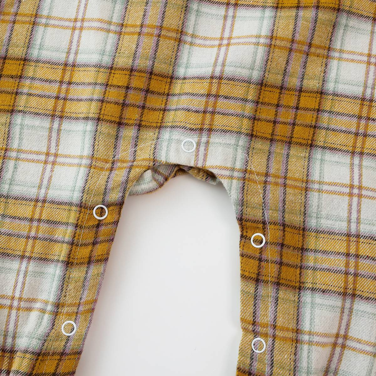 Baby girl romper featuring a plaid pattern and mesh patchwork design with a doll neck bow tie, available in pink and yellow.