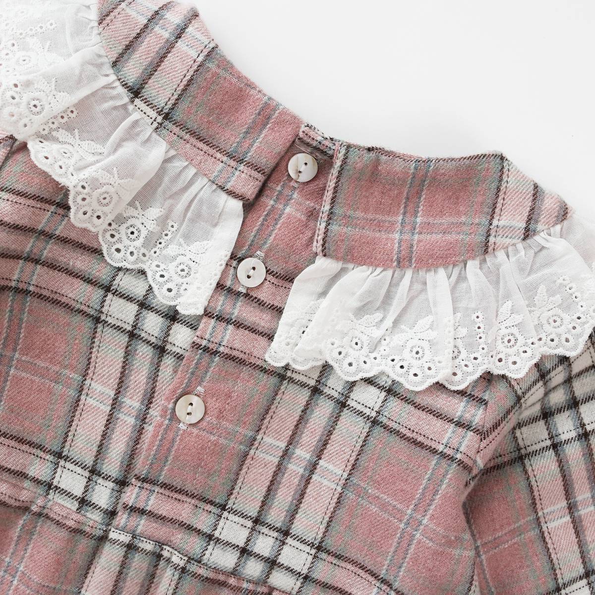 Baby girl romper featuring a plaid pattern and mesh patchwork design with a doll neck bow tie, available in pink and yellow.