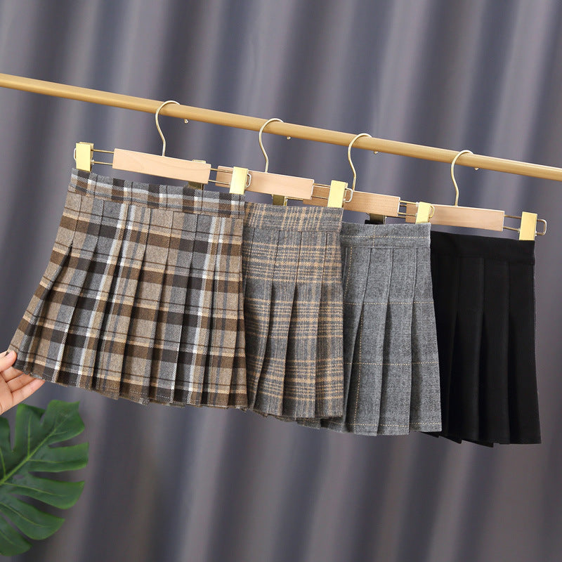 A stylish Baby Girl Plaid Pattern Pleated Skirt in various colors, showcasing its pleated design and plaid pattern, perfect for autumn wear.
