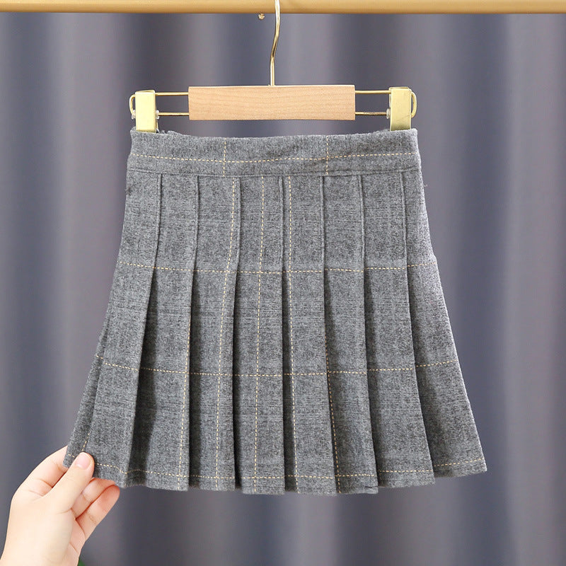 A stylish Baby Girl Plaid Pattern Pleated Skirt in various colors, showcasing its pleated design and plaid pattern, perfect for autumn wear.