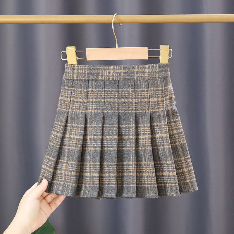 A stylish Baby Girl Plaid Pattern Pleated Skirt in various colors, showcasing its pleated design and plaid pattern, perfect for autumn wear.