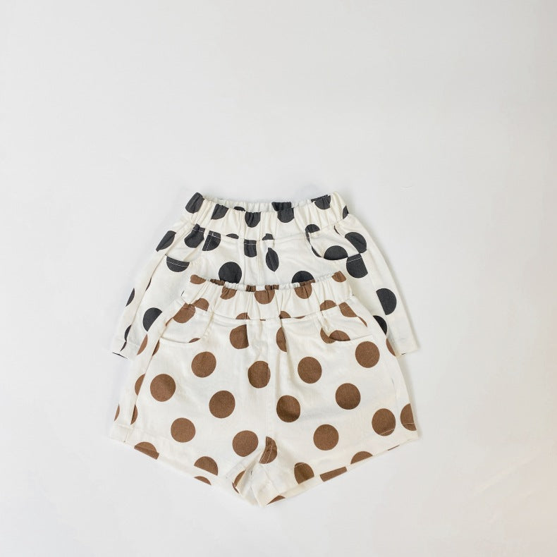 Baby girl polka dot pattern basic shorts in black and brown with pockets, perfect for summer wear.