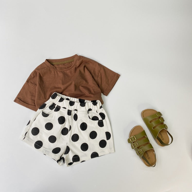Baby girl polka dot pattern basic shorts in black and brown with pockets, perfect for summer wear.