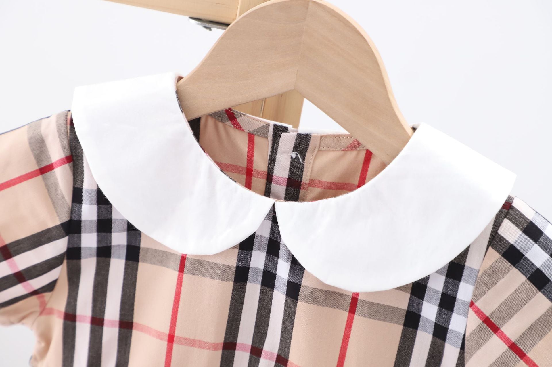 Baby girl dress featuring a doll collar design in khaki color with a plaid pattern, perfect for summer occasions.