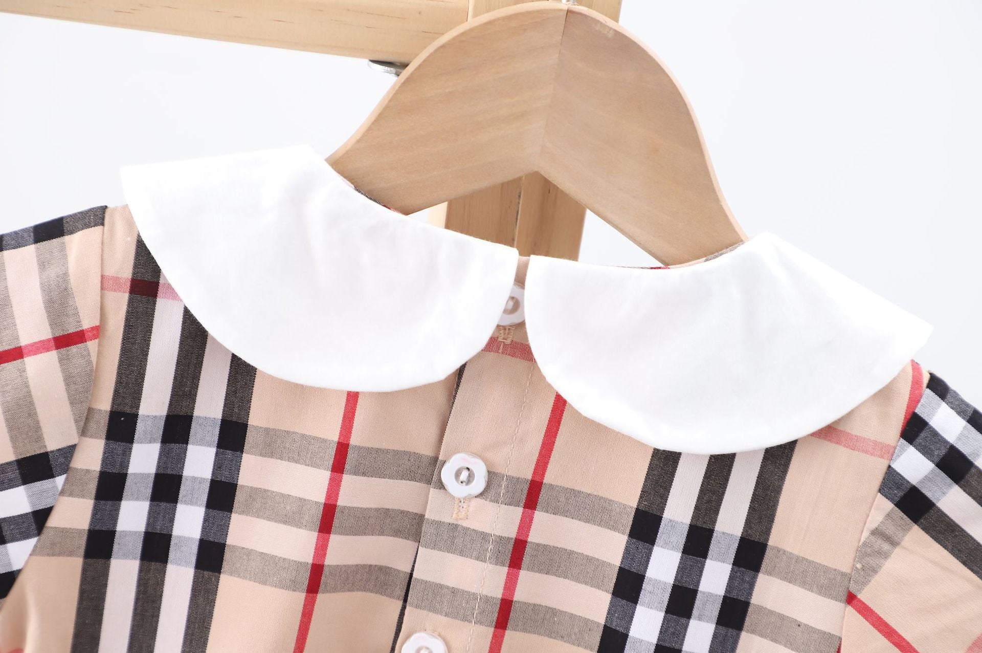 Baby girl dress featuring a doll collar design in khaki color with a plaid pattern, perfect for summer occasions.