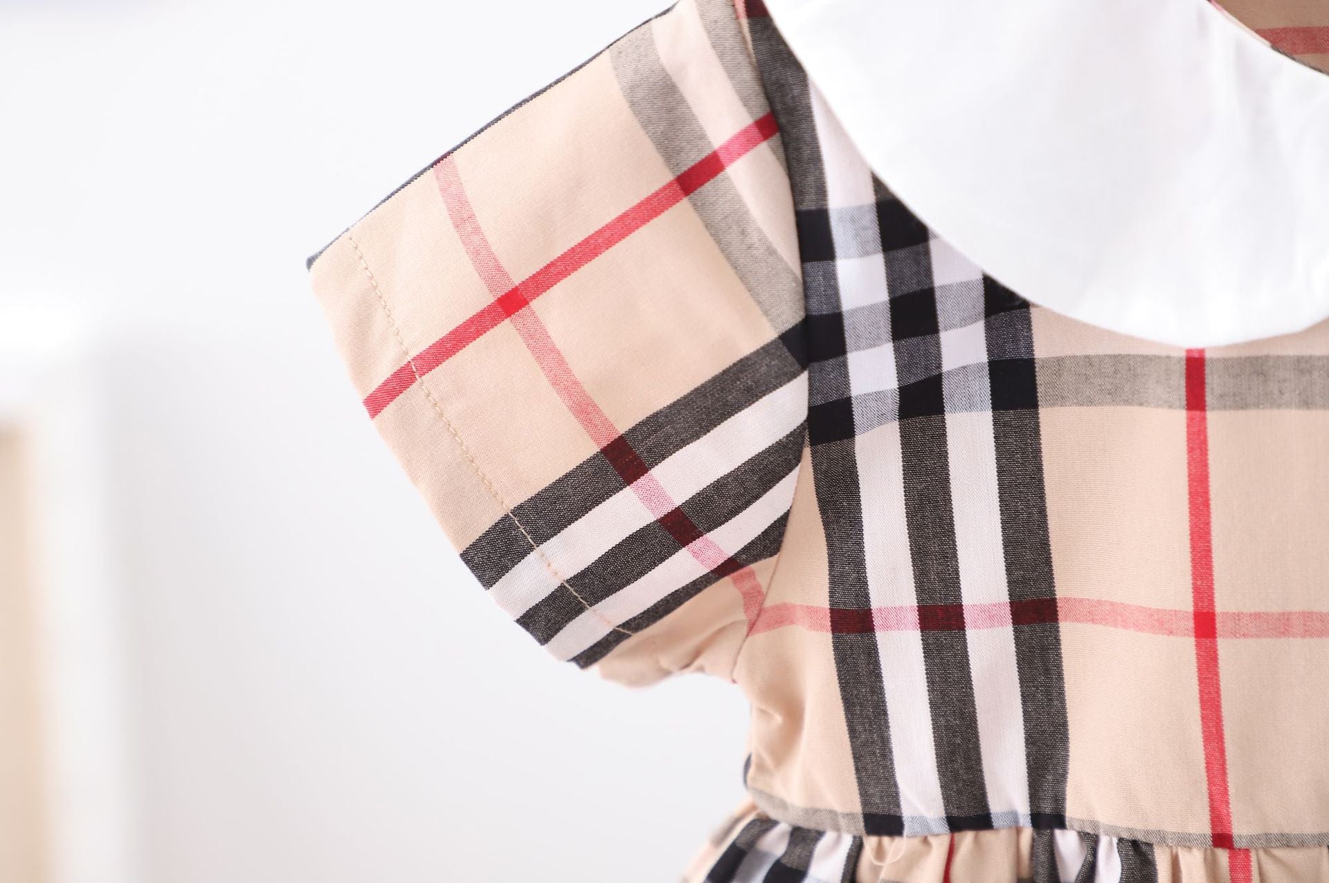 Baby girl dress featuring a doll collar design in khaki color with a plaid pattern, perfect for summer occasions.