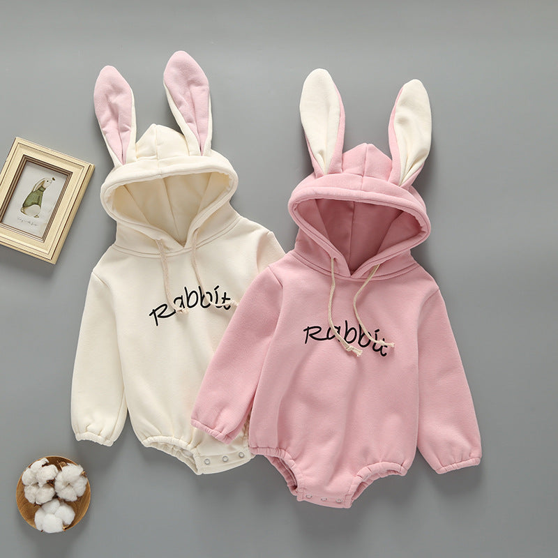 Baby girl wearing a cute rabbit ear design long sleeved onesie in pink, showcasing a playful print pattern.