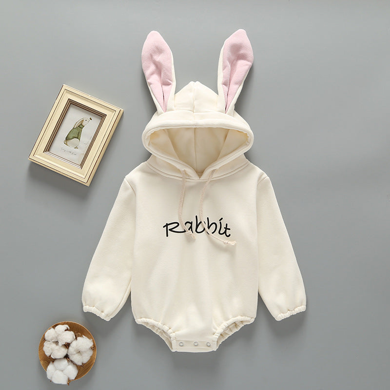 Baby girl wearing a cute rabbit ear design long sleeved onesie in pink, showcasing a playful print pattern.